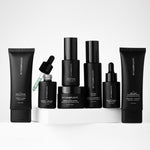 Collection of black withSimplicity skincare products with withSimplicity branding on a white background