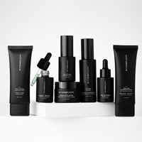 Collection of black withSimplicity skincare products with withSimplicity branding on a white background