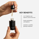 withSimplicity natural organic Vitamin C Serum held in hand with dropper out. Text on image: Vitamin C brightens and balances uneven skin tone, full of antioxidants to defend skin and reduce inflammation, and promotes a youthgul, glowing complexion.