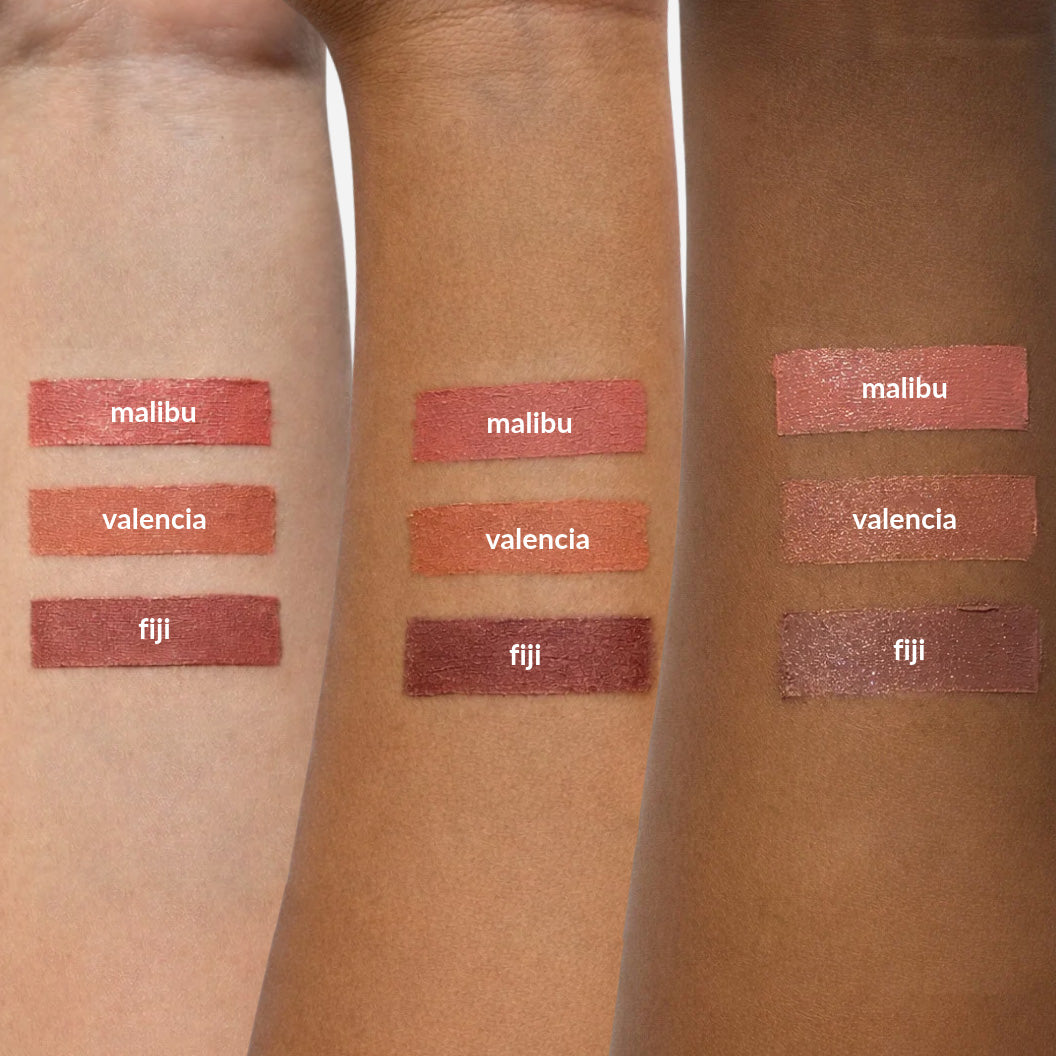 swatches of withSimplicity Tri-Sticks on three different arms of different skin colors