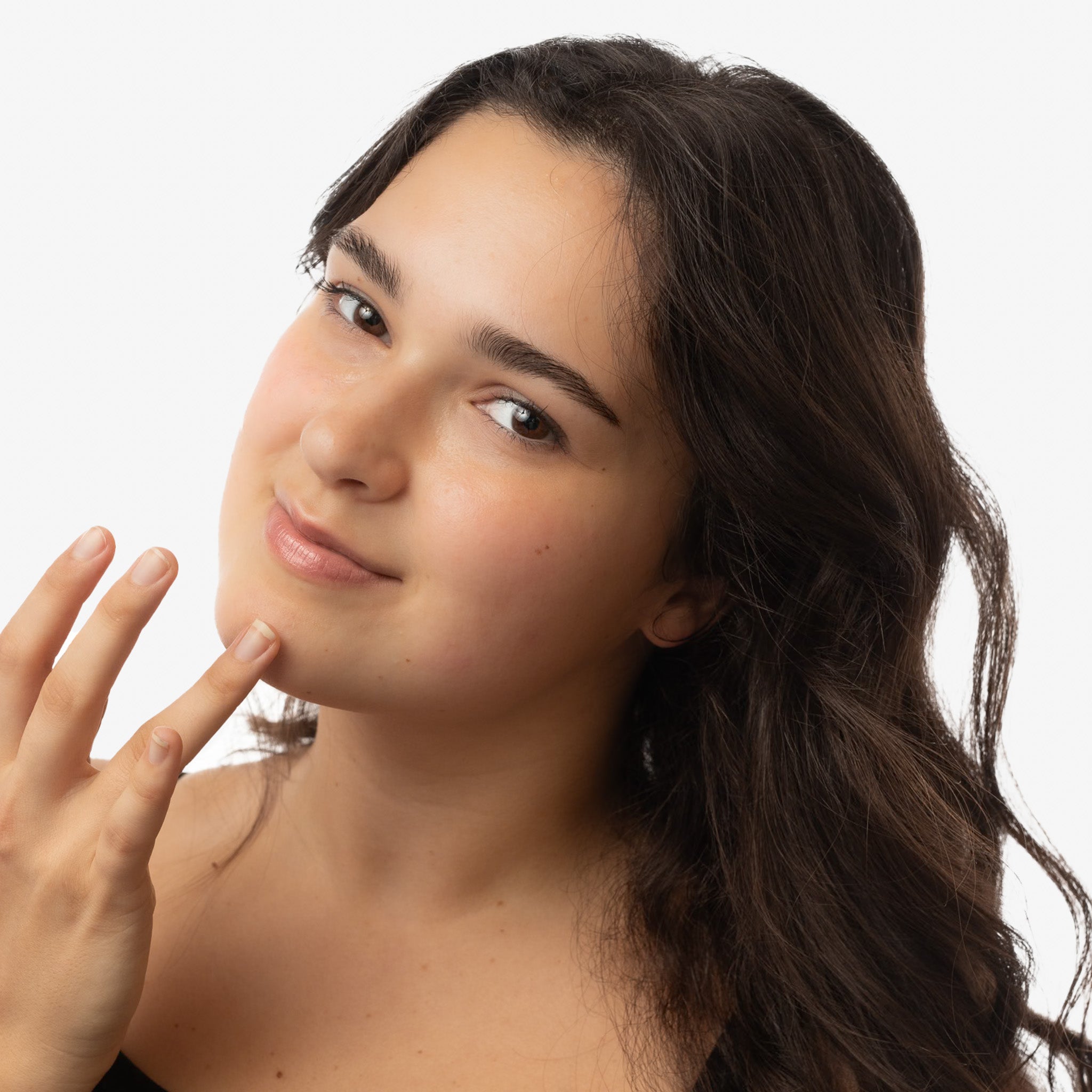 woman applying blemish drops spot treatment to face