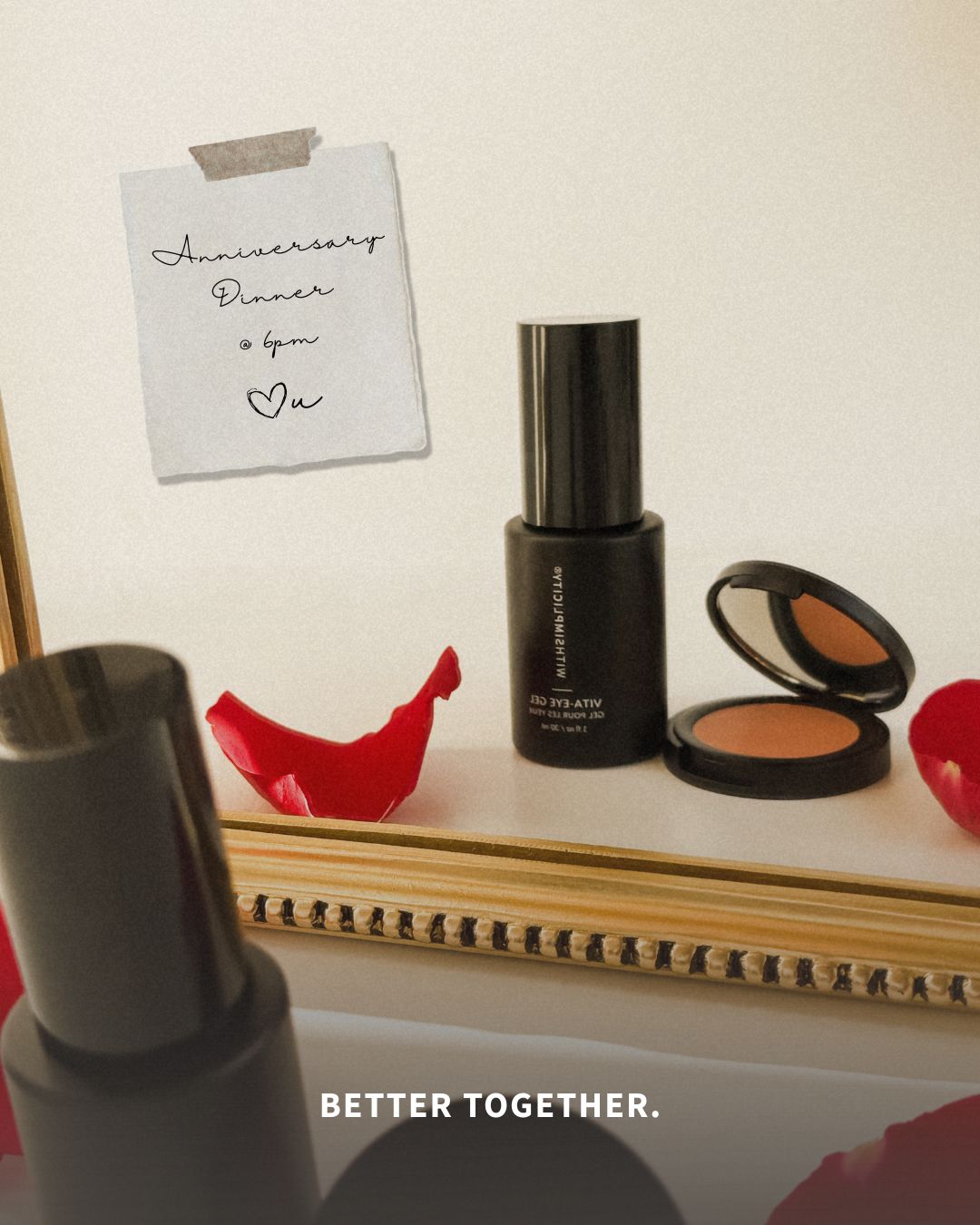 A romantic vanity mirror scene with withSimplicity’s Vita-Eye Gel and an open under-eye color corrector compact surrounded by red rose petals. A handwritten note taped to the mirror reads Anniversary Dinner at 6pm and the words BETTER TOGETHER appear at the bottom.