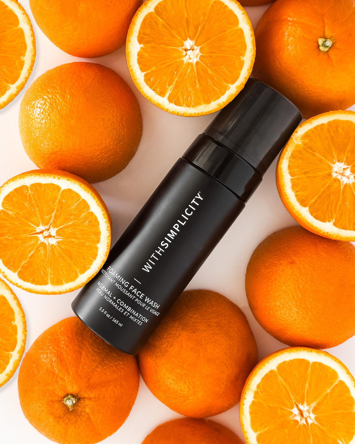 wihsimplicity Foaming Face Wash Normal Combo surrounded by oranges