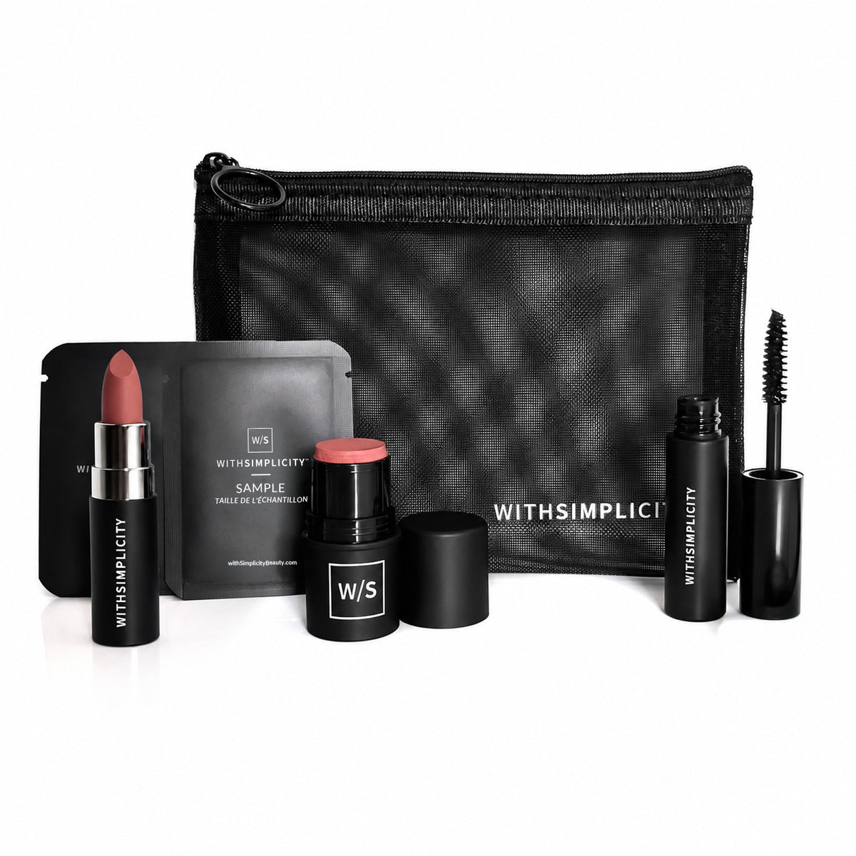 withSimplicity clean makeup kit with lipstick, cheek tint, mascara, and cosmetic bag against white background