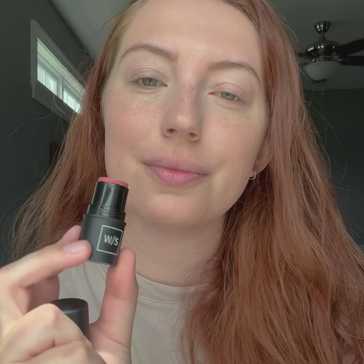 woman showing how to use the withSimplicity Tri-Stick cheek color in a video