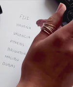 person drawing swatches of withSimplicity Tri-Stick colors next to names on white sheet of paper