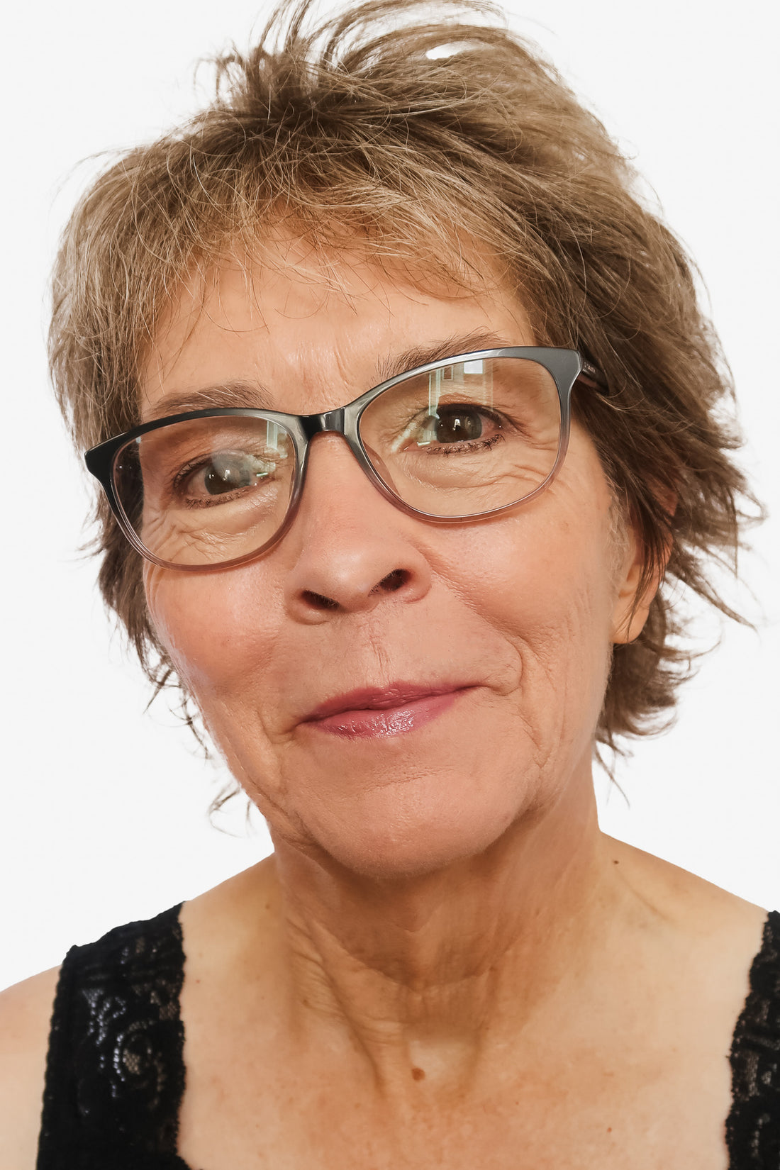 woman with mature skin having makeup applied to face