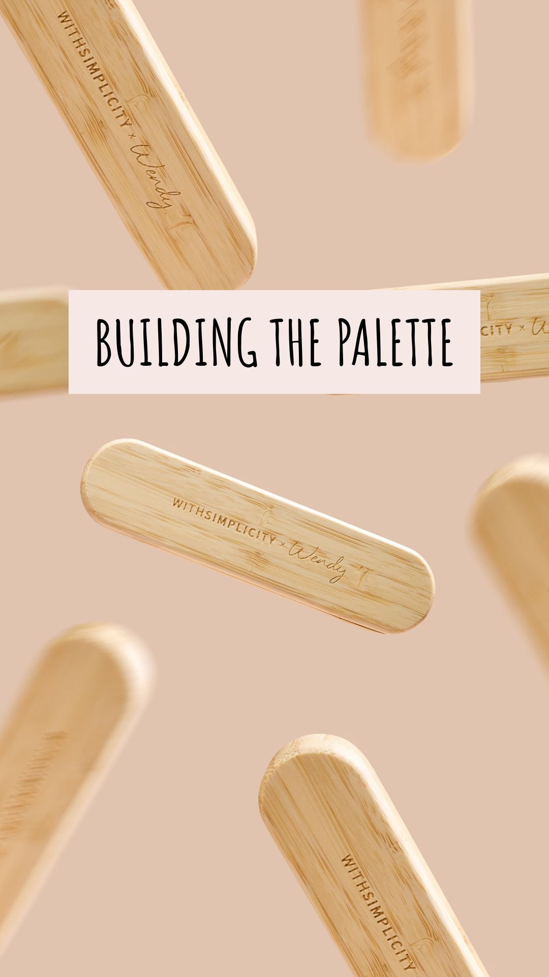 Behind-the-scenes video of a woman in a black apron making pressed eyeshadow in a workshop, pouring pigment into round pans, then unboxing and holding up a rose-pink WITHSIMPLICITY x Wendy Sundrenched Sunset eyeshadow palette box, smiling.