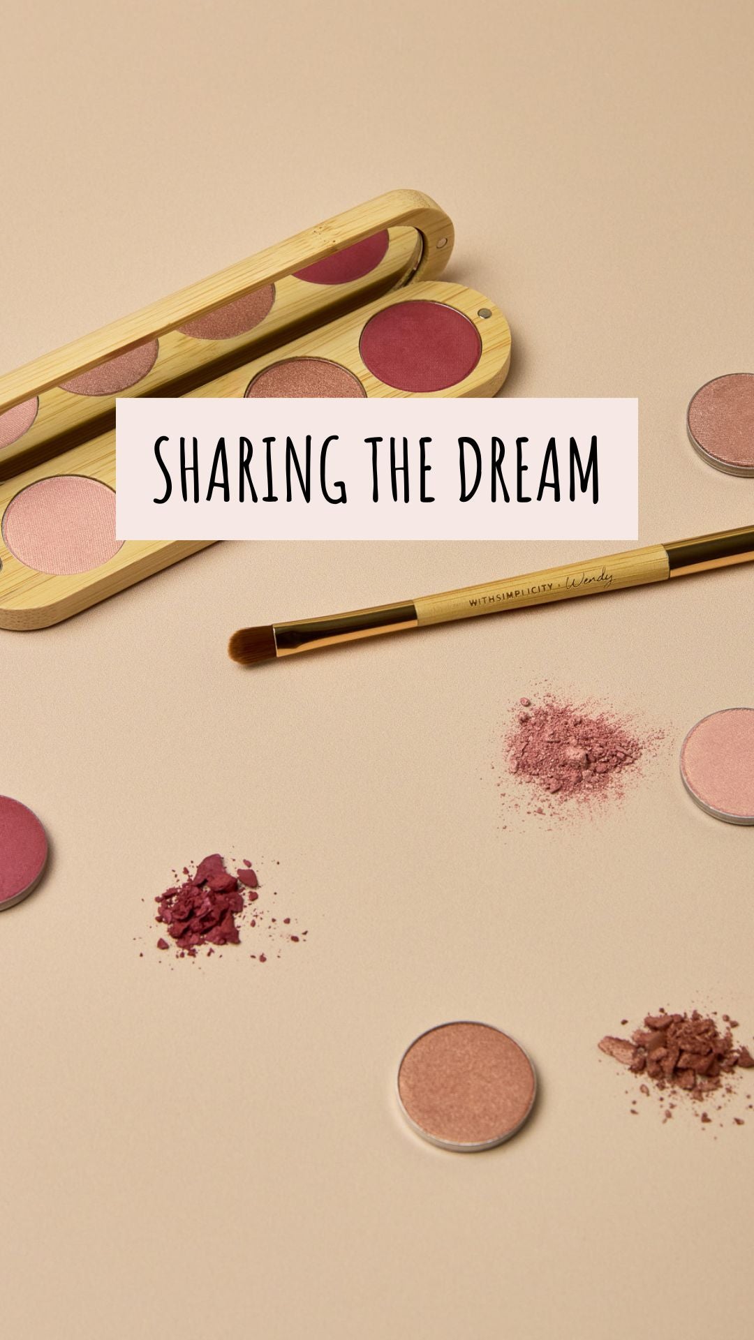 Woman with long brown hair and a pink headband talks to the camera while wearing a shimmery copper eyeshadow look, then holds up and opens a wooden compact eyeshadow palette, smiling as she reveals the withSimplicity branding.