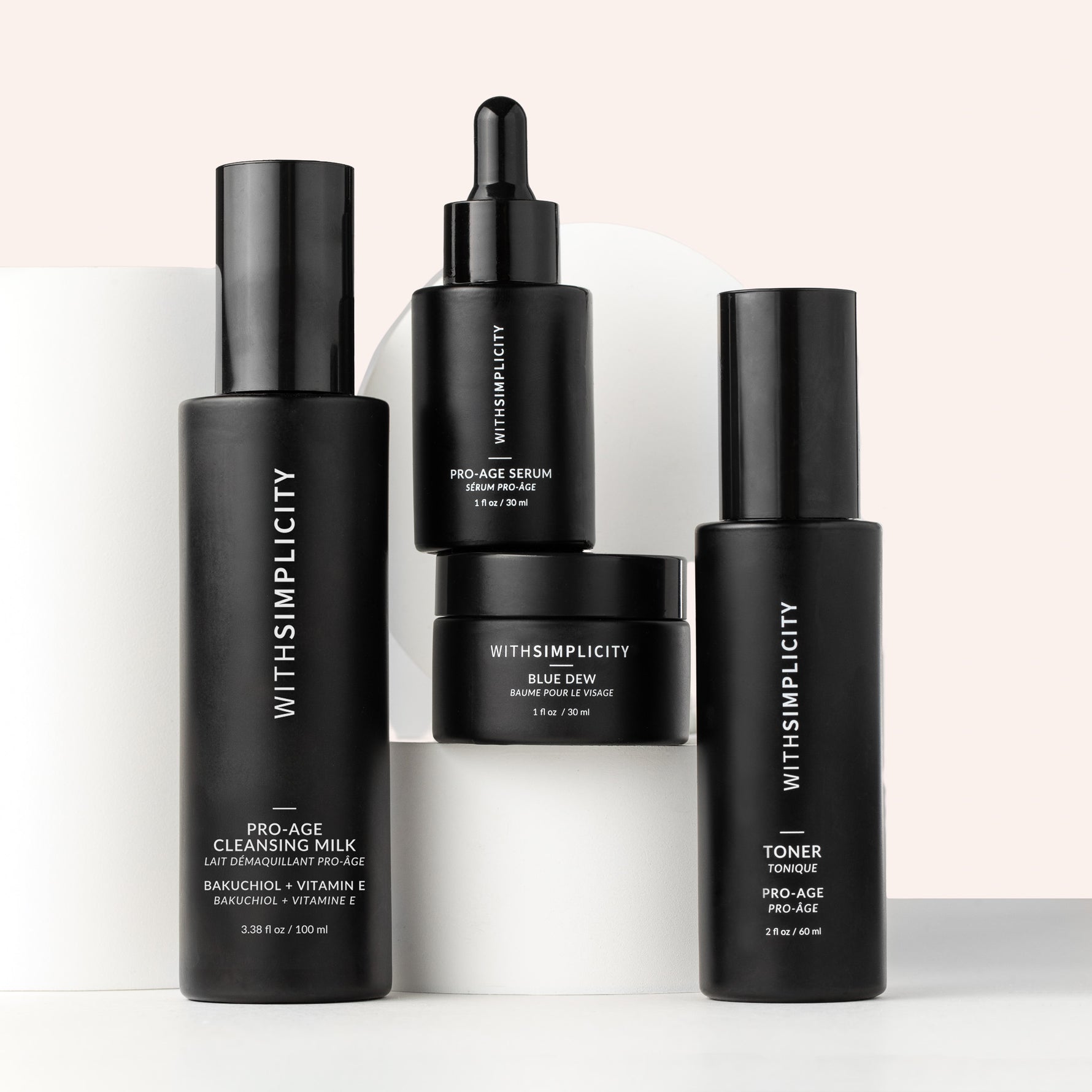 Set of withSimplicity skincare products on a tan background