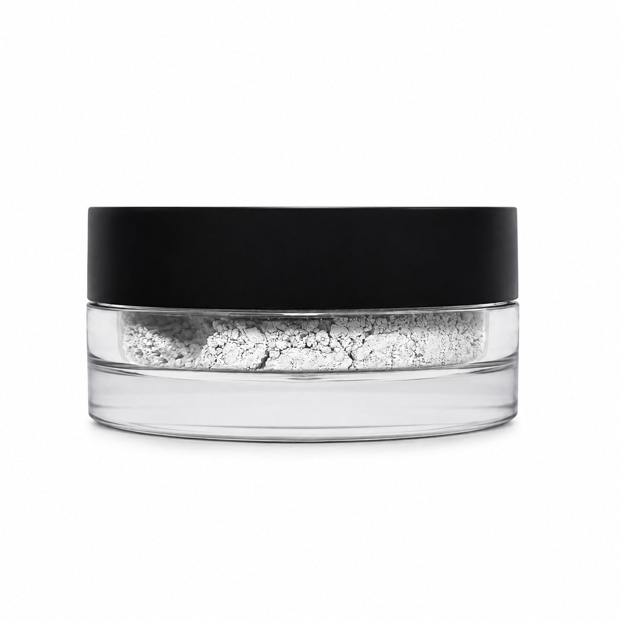 Clear container with black lid filled with white powder on a white background