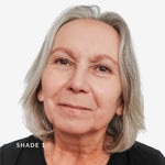 Close-up of a person with gray hair against a white background. Text says Shade 1
