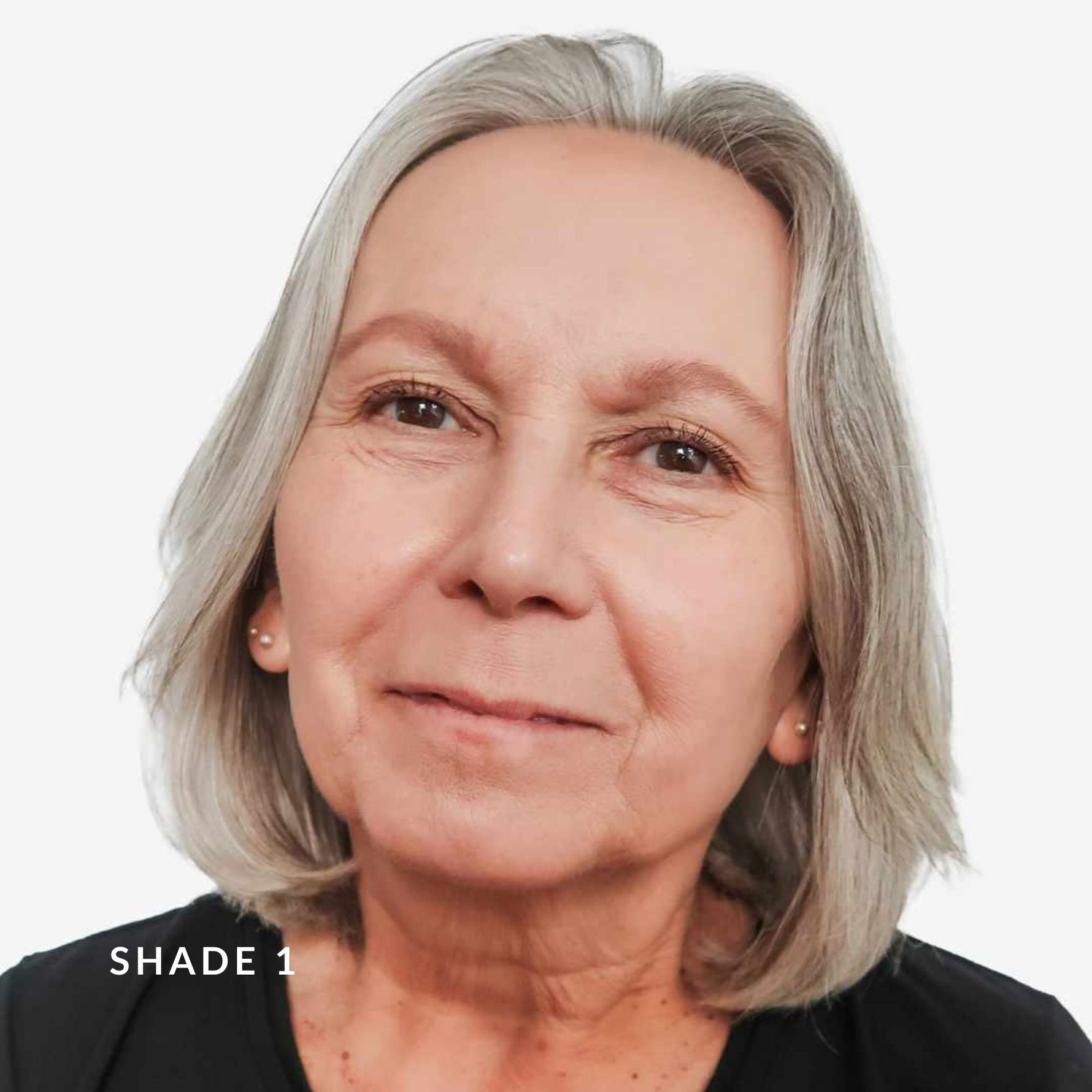 Close-up of a person with gray hair against a white background. Text says Shade 1