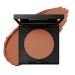 deep reddish-brown natural cream concealer in black square compact