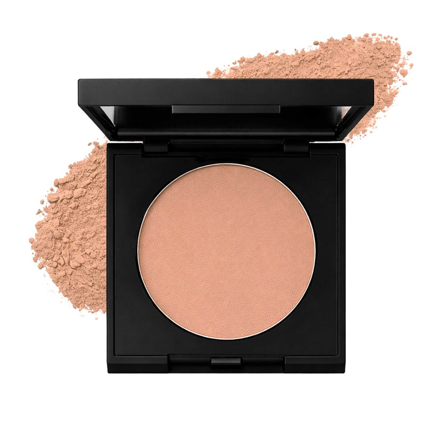 Compact warm neutral blush  in a black case with a scattering of powder on a white background